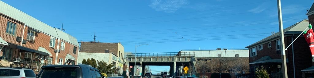 Street-level daytime example from Astoria Nyc, cropped to the middle of the scene.