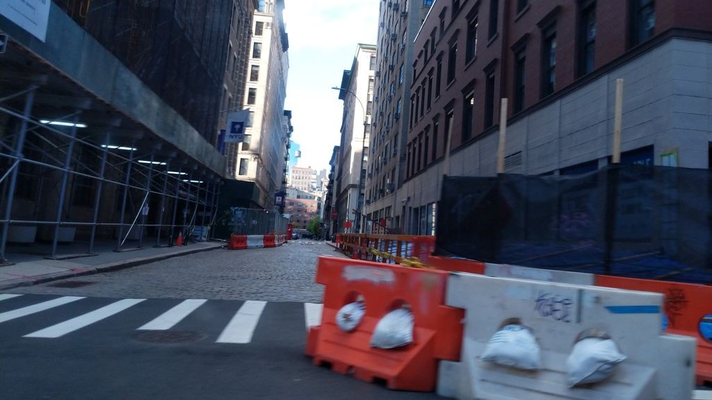 Street-level daytime example from Downtown Manhattan Nyc, cropped to show the local street context.