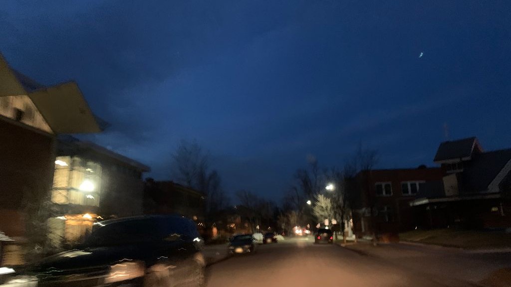 Street-level low light example from Highlands Sloans Lake Denver, cropped to show the local street context.