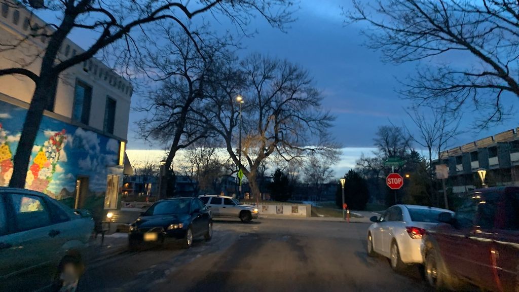 Street-level low light example from Highlands Sloans Lake Denver, cropped to show the local street context.