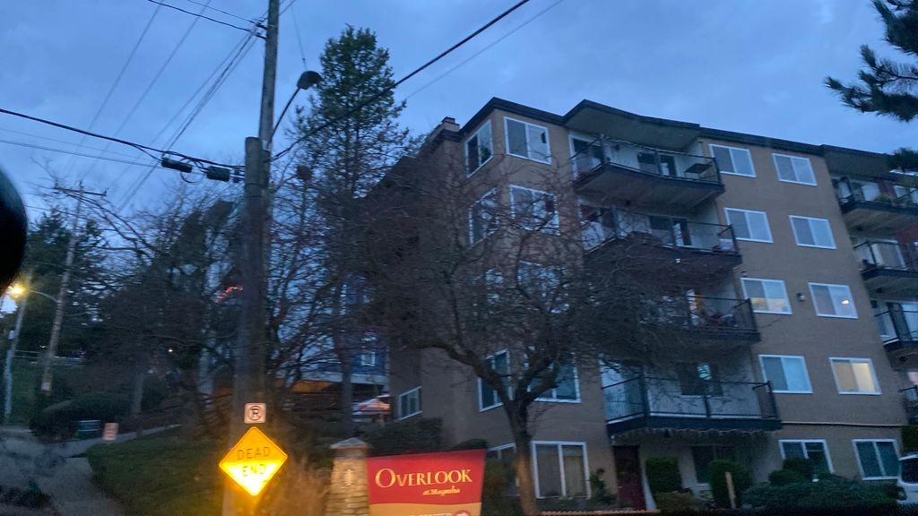 Street-level low light example from North Seattle, cropped to show the local street context.