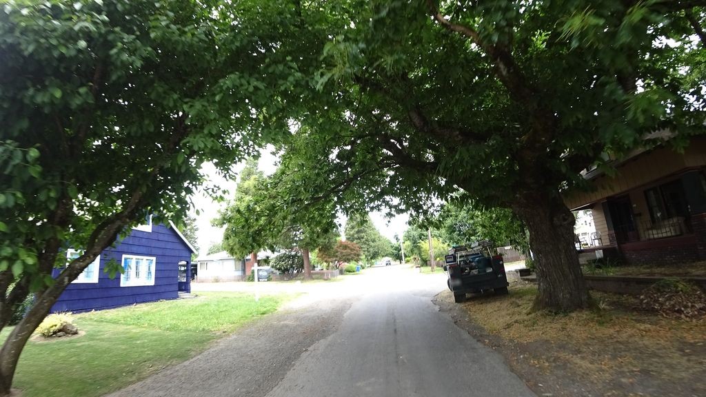 Street-level daytime example from Portland East 82Nd, cropped to show the local street context.