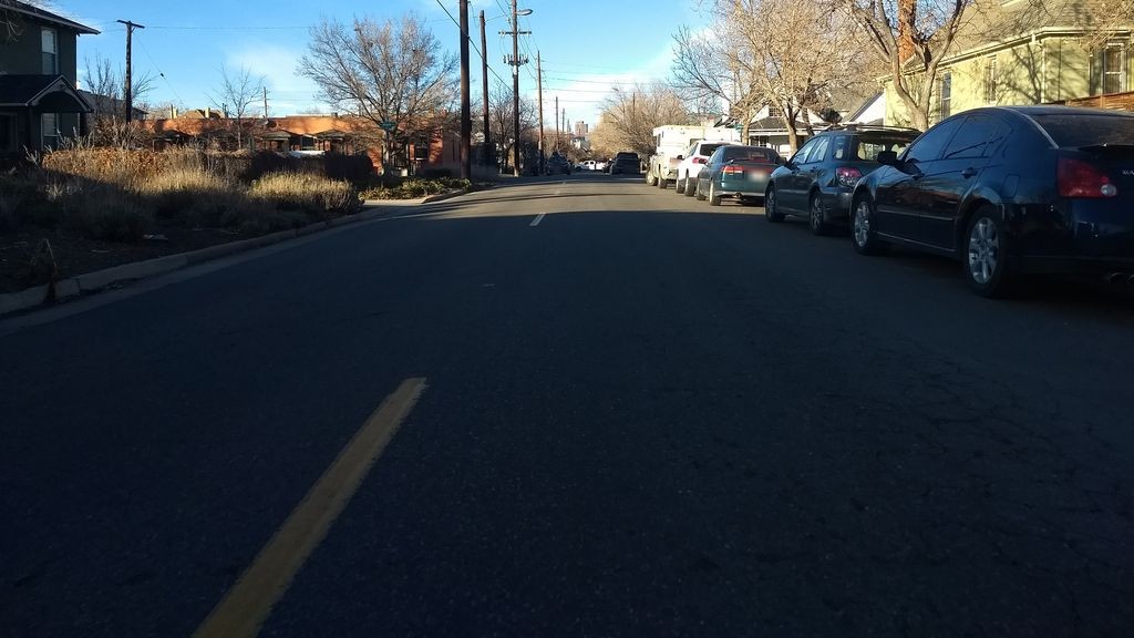 Street-level daytime example from Wash Park Denver, cropped to show the local street context.